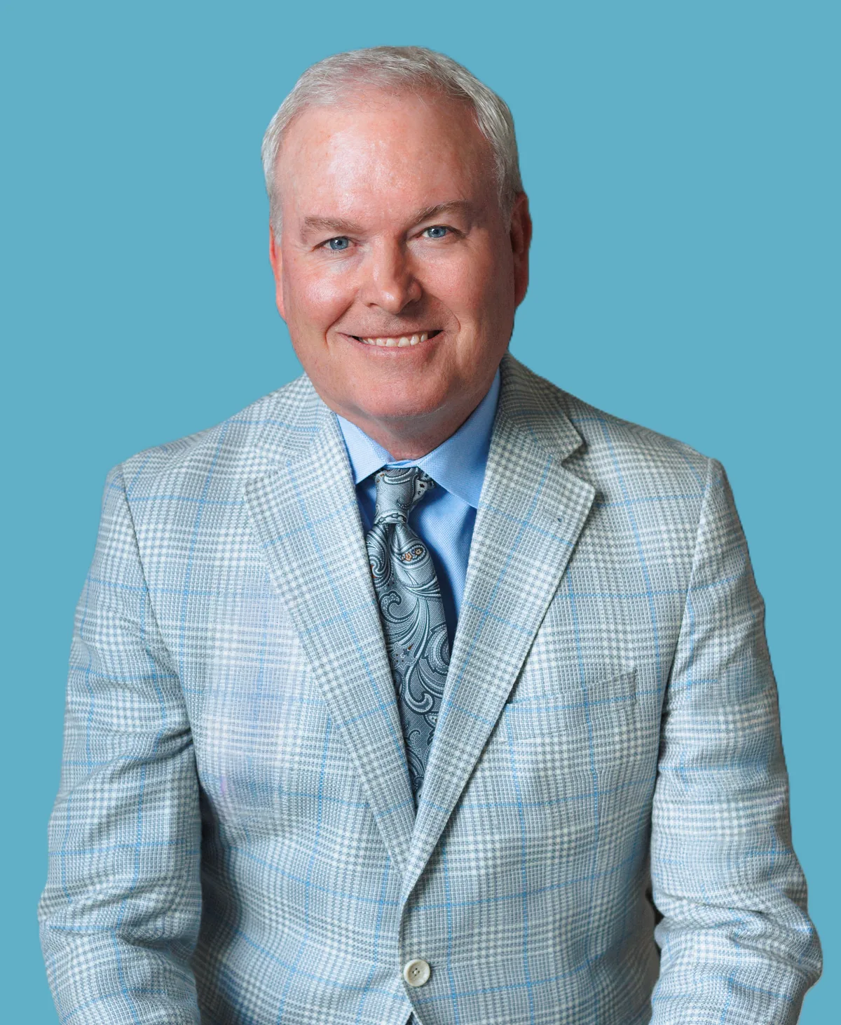 Headshot of Bowie Neumayer, President of Cardinal Glass Industries.